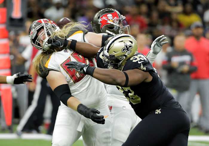 Oct 6, 2019; New Orleans, LA, USA; New Orleans Saints defensive tackle David Onyemata (93) rushes against Tampa Bay Buccaneers offensive guard Alex Cappa (65) during the first quarter at the Mercedes-Benz Superdome. Mandatory Credit: